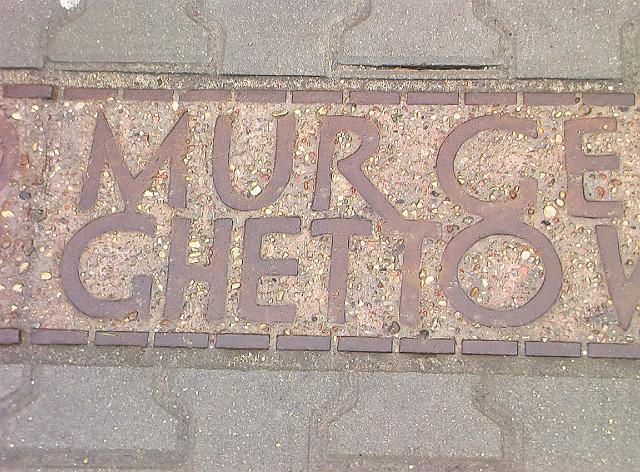020.JPG - You're looking at a memorial to mark where part of the wall was located for the WWII Warsaw Ghetto.  The wall went up to isolate Jews in late 1940 in an echo of what happened to Jews in medieval Europe, but now with much more malevolent intent.